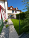 Schickes Reihenhaus mit zwei sonnigen Terrassen und Garten in familienfreundlicher Lage - Gebäudeansicht
